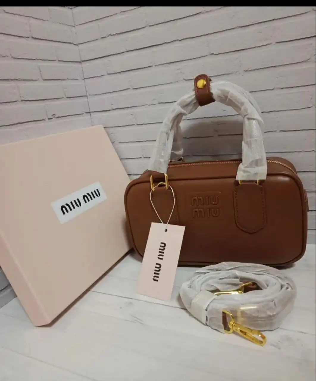 Продажа брендовых сумок Coach и Miu Miu