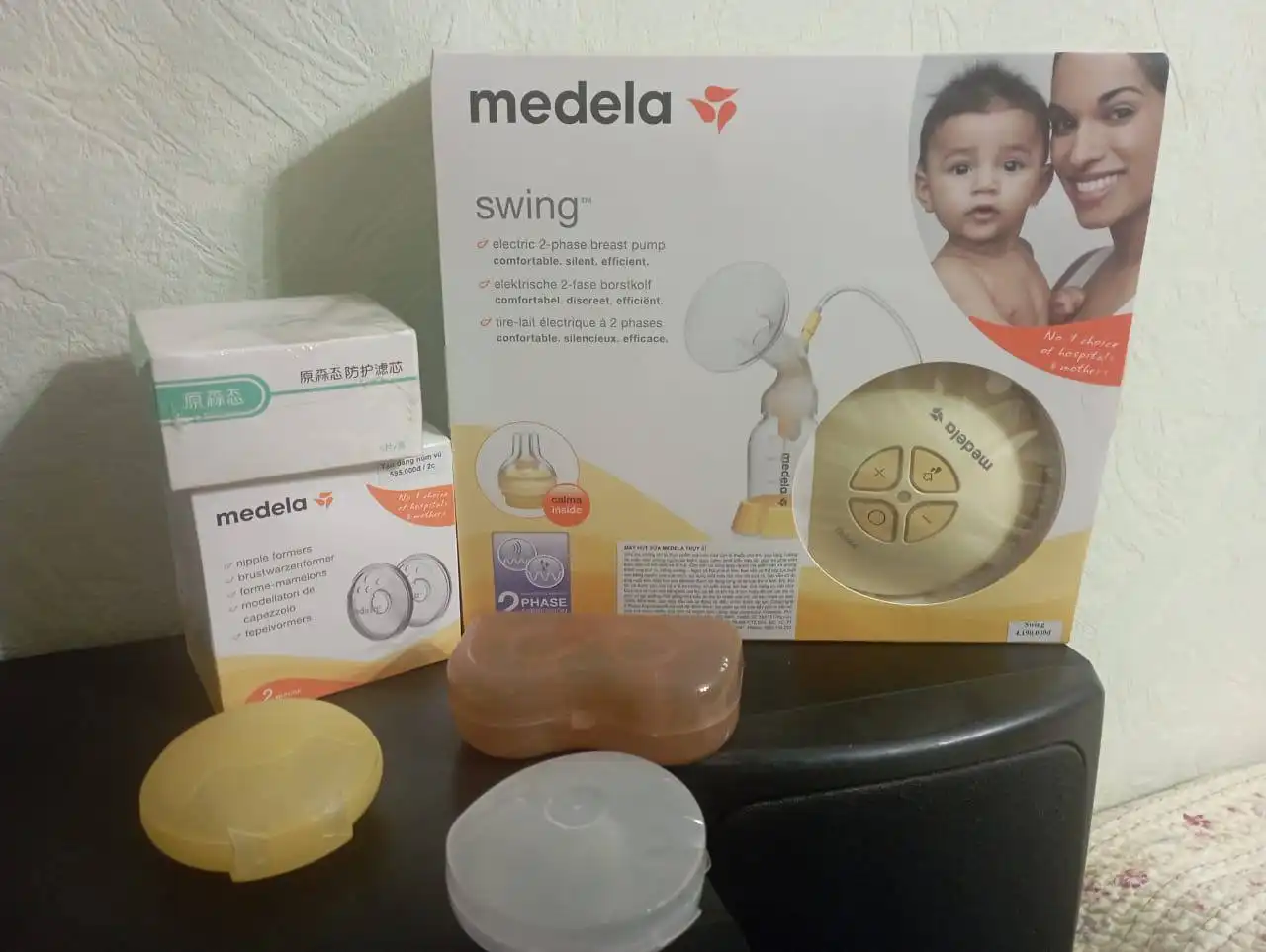 Электрический молокоотсос с насадками