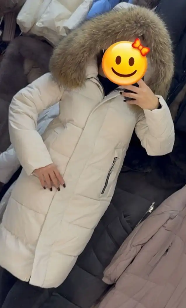 Продам новый зимний пуховик с натуральным мехом