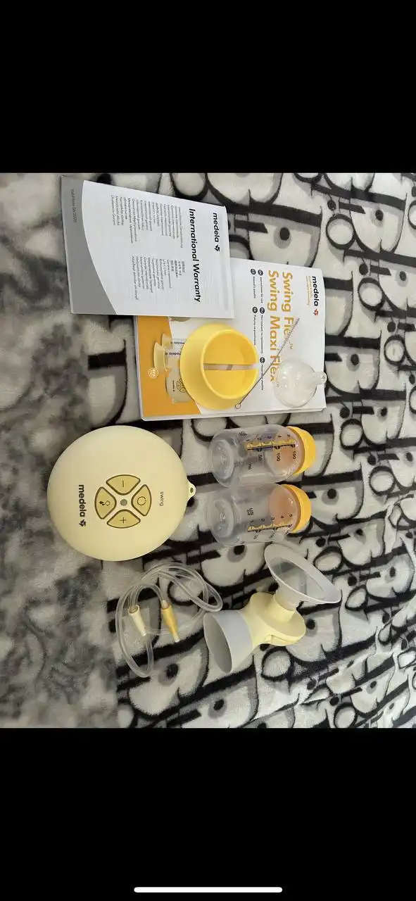 Молокоотсос Medela Swing Maxi электронный портативный