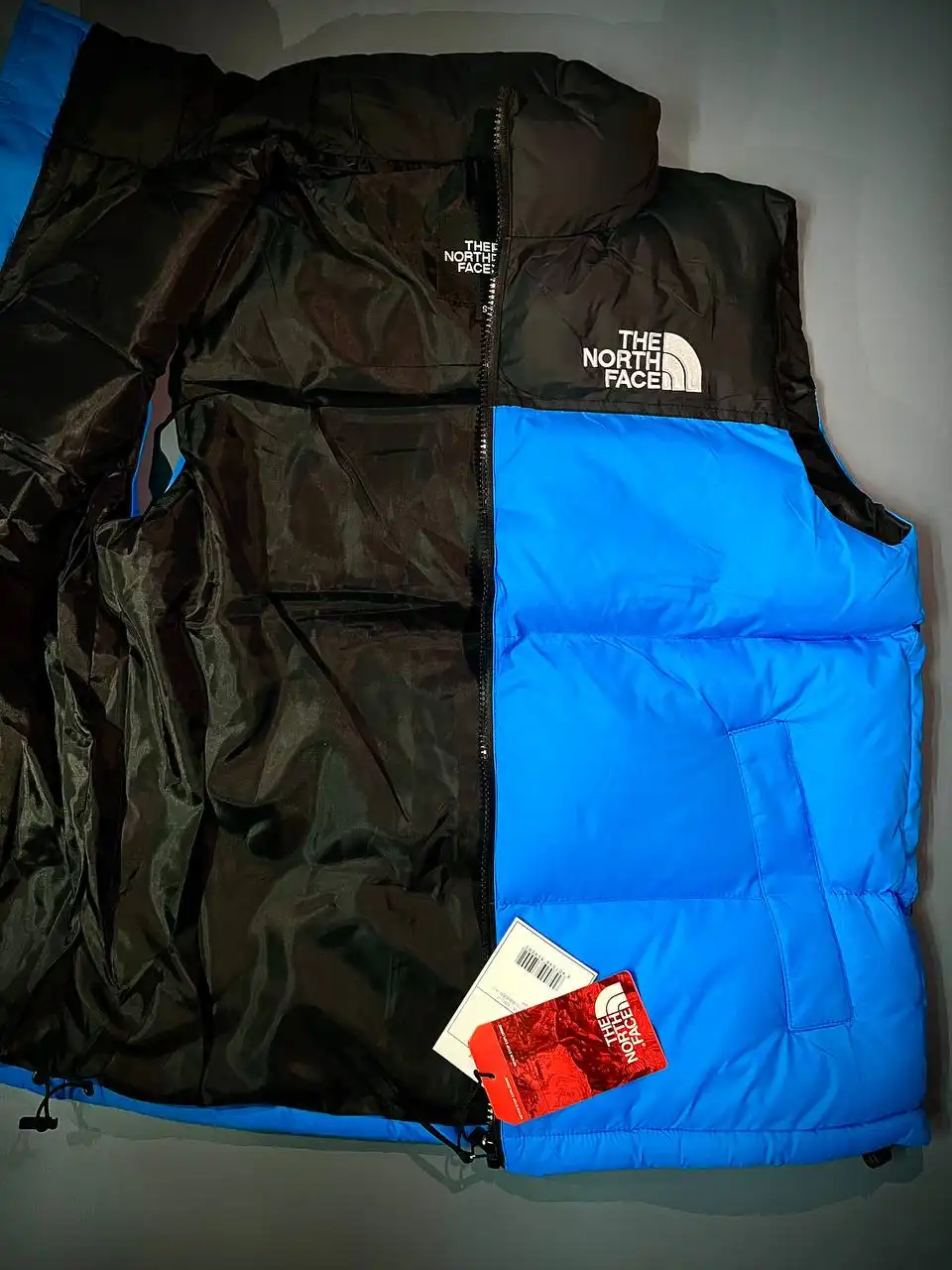 Сочные яркие жилетки The North Face синего и оранжевого цвета - Верхняя одежда (Одежда) в Казань
